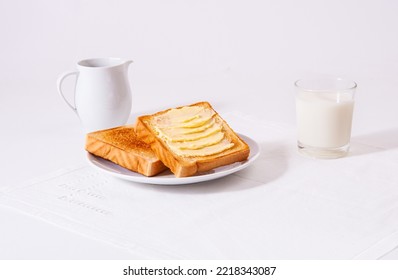 toasted bread with spread butter and milk vase - Powered by Shutterstock