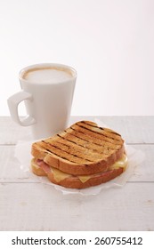 Toasted Cheese And Ham Sandwich With Coffee