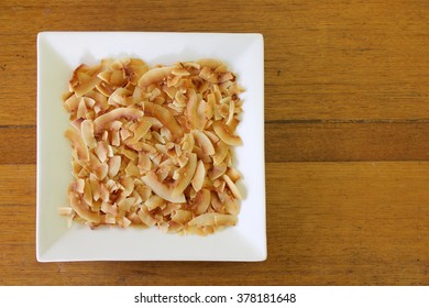 Toasted Coconut Flakes On Plate 1