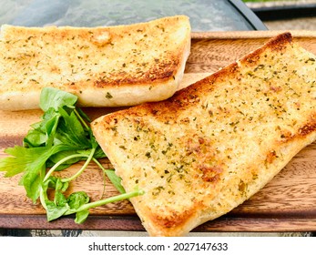 Toasted Garlic Ciabatta Bread Served On A Wood Board