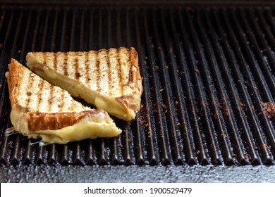 Toasted Sandwiches With Melting Cheese On Toast Machine Or Grill.