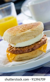 Toasted Sausage And Egg Muffin On A Breakfast Table