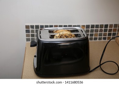 Toaster Waffles. Breakfast Waffles Being Toasted In A Kitchen Toaster. Hot Toasted Pancakes Or Waffles For Breakfast Or A Snack.