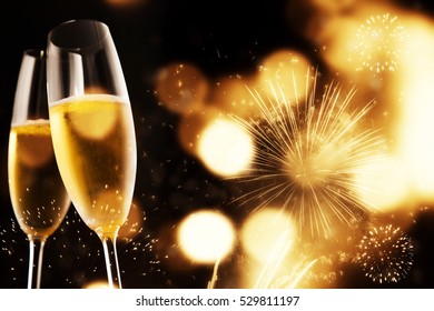 Toasting With Champagne Glasses On Sparkling Holiday Background