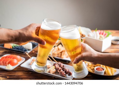 Toasting Image With Beer And Japanese Izakaya Food