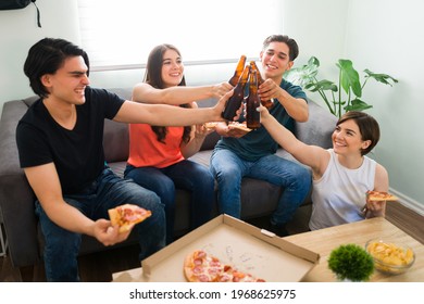 Toasting For More Times Like These. Group Of Best Friends Making A Toast With Beer And Celebrating The End Of The College Semester With Pizza