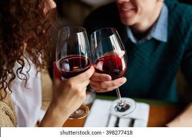 Toasting with red wine - Powered by Shutterstock