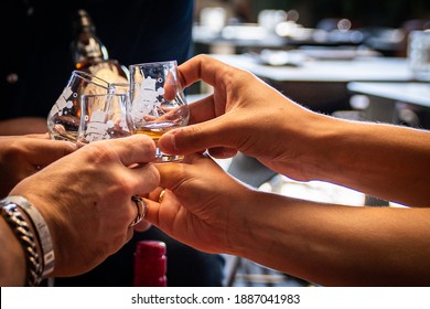 Toasting Together On A Whiskey Tasting Event.