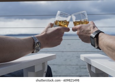 Toasting Whiskey On Ice Seaside Deck Outside