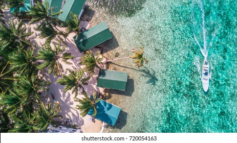 Tobacco Caye aerial in Belize barrier reef with boat