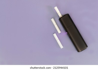 Tobacco Heating System. The Latest Electronic Cigarette. IQOS Tobacco Heating System. Heat Do Not Burn Tobacco Products.