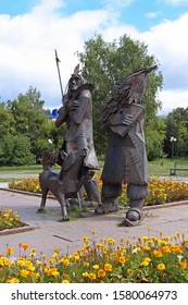 TOBOLSK, RUSSIA-AUGUST 30, 2013: Monument To The Heroes Of Daniel Defoe's Famous Novel Robinson Crusoe, Friday And The Dog Laika