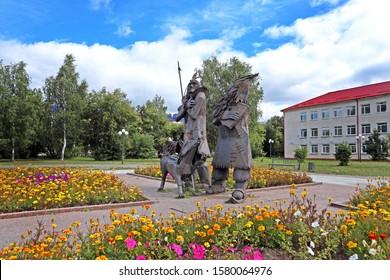 TOBOLSK, RUSSIA-AUGUST 30, 2013: Monument To The Heroes Of Daniel Defoe's Famous Novel Robinson Crusoe, Friday And The Dog Laika