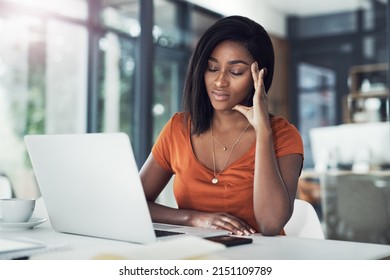 Today Has Been Beyond Stressful. Shot Of An Attractive Young Businesswoman Suffering From A Headache In Her Office.