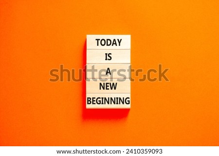 Today is a new beginning symbol. Concept words Today is a new beginning on wooden blocks. Beautiful orange table orange background. Business today is a new beginning concept. Copy space.