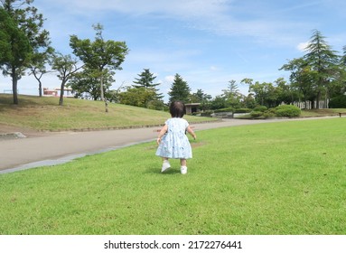 Toddle Baby Girl In The Green Park         