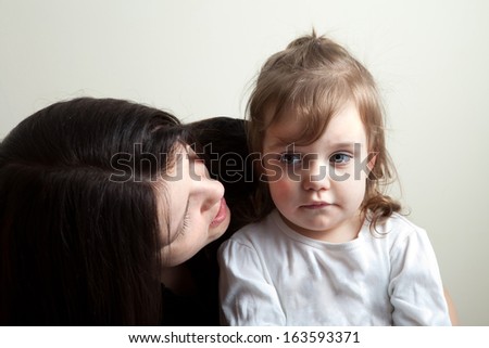 Toddler age girl getting spoken to by her mother. Great parenting concept image.