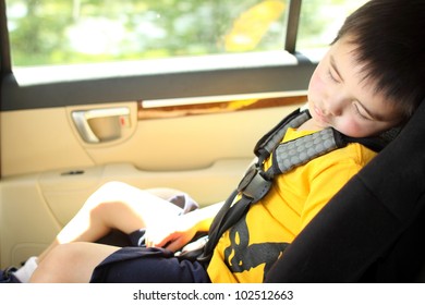 Toddler Asleep In A Child Safety Seat In A Car.