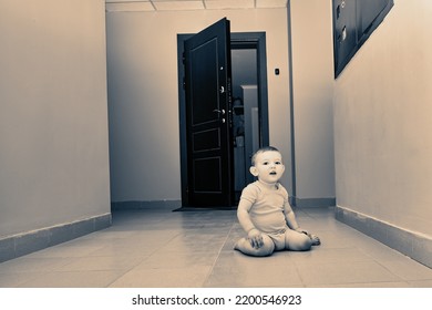 Toddler Baby Crawls Out Of The Open Apartment Door. Child Boy Runs Away From Home. Kid Age One Year