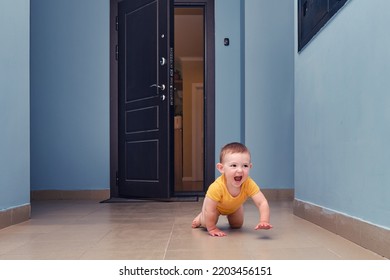 Toddler Baby Crawls Out Of The Open Apartment Door. Child Boy Runs Away From Home. Kid Age One Year