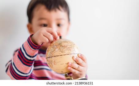 Toddler Baby Kid And Earth Day.World Environment Day.Kid Hands Holding Earth Globe Banner Isolated Background.CSR.research, Discovery, Planet, Go Green.Climate Change.human Children Child Discovery.