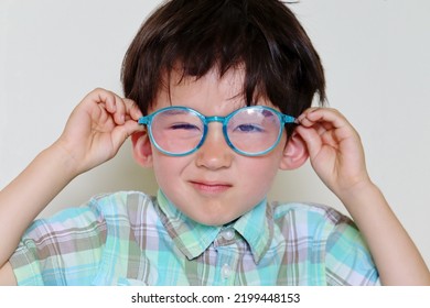 Toddler Boy With Blue Light Blocking Glasses