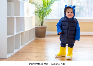 Toddler Boy Bundled Up In Winter Clothes Ready To Go Outside