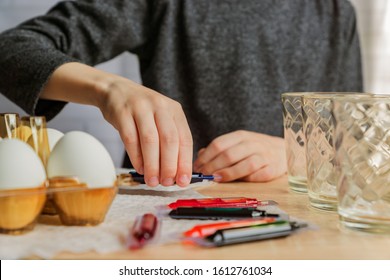 toddler boy coloring eggs for easter. easter, family, holiday concept  - Shutterstock ID 1612761034