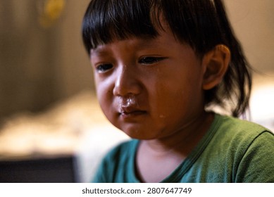 Toddler Boy Crying With snot Bubble In His Nose, sick baby child with flu for healthcare family marketing campaign, brand awareness, pediatric medical care, childhood sickness and parenting comfort.