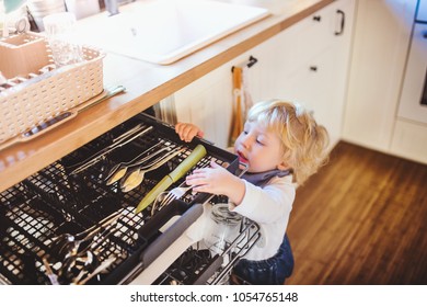 Toddler Boy In Dangerous Situation At Home. Child Safety Concept.