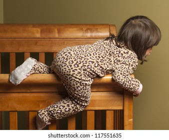 Toddler Climbing Out Of Her Crib.