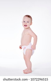 Toddler In Diaper Standing At Studio Shot 