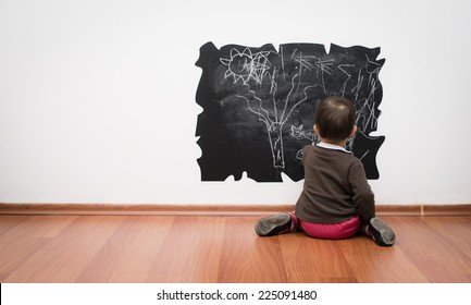 Toddler drawing on the wall