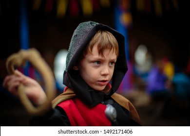 Toddler dressed up as knight in Medieval Festival - Powered by Shutterstock