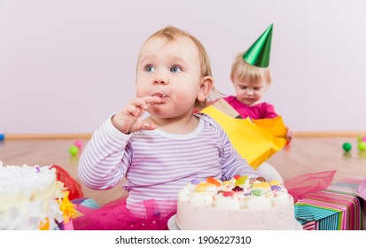 Toddler Eating Birthday Cake In Kindergarten