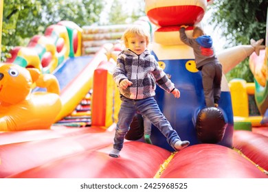 Toddler Enjoying Time at Colorful Play Park - Powered by Shutterstock