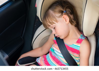 Toddler Girl Asleep In A Child Safety Seat In A Car