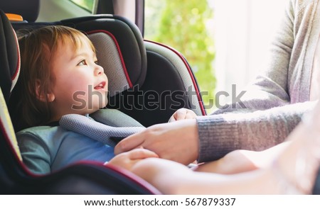 Toddler girl buckled into her car seat Foto stock © 