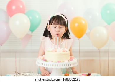Toddler Girl Celebrating Her 4th Birthday At Home 