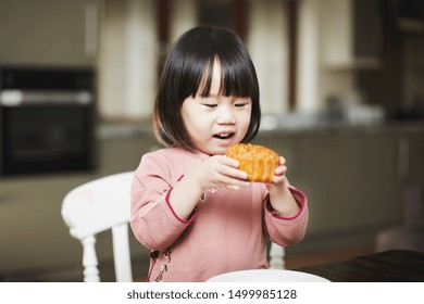 Toddler Girl Eating Moon Cake And Celebrating Mid Autumn Festival