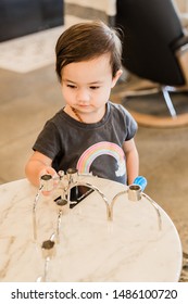 Toddler Girl Exploring Furniture Show Room