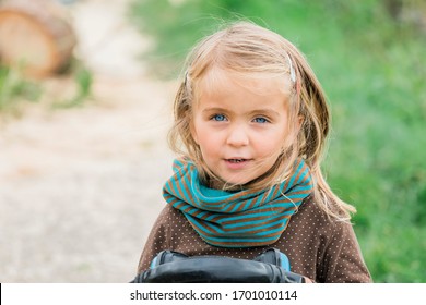 Toddler Girl Holding Earmuffs - Kempen, Germany