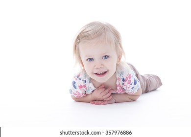 Toddler Girl Laying Down, Isolated On White