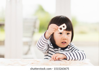 Toddler Girl Learning Alphabet Letter At Home 