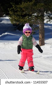 A Toddler Girl Learns Cross-country Skiing At Lake Tahoe Ski Resort In Sierra Nevada Mountains, California.