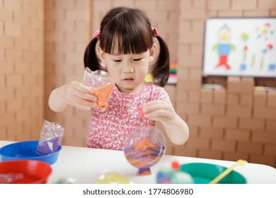 toddler girl making sand animal crafts for homeschooling - Shutterstock ID 1774806980