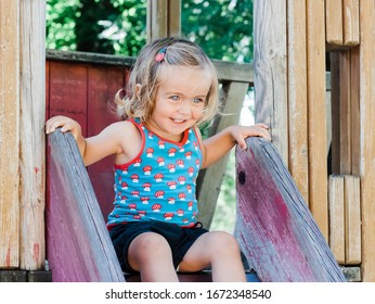 Toddler girl on playground slide – Kempen, Germany, Europe