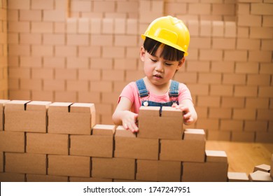 Toddler Girl Pretend Play Builder Role By Using Cardboard Blocks