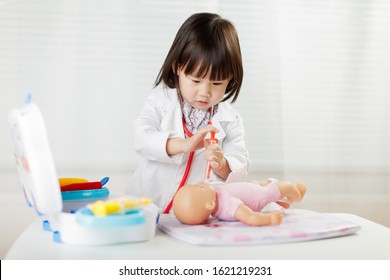 Toddler Girl Pretend Play  Doctor Role  At Home Against White Background