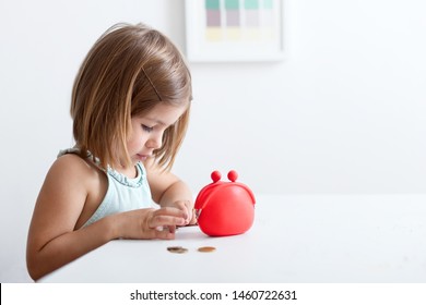 Toddler Girl With Red Wallet,purse Play With Coins.  Financial Support, Business, Family, Alimony, Maintenance, Investing In Children .Learning Financial Responsibility And Planning Savings Concept 